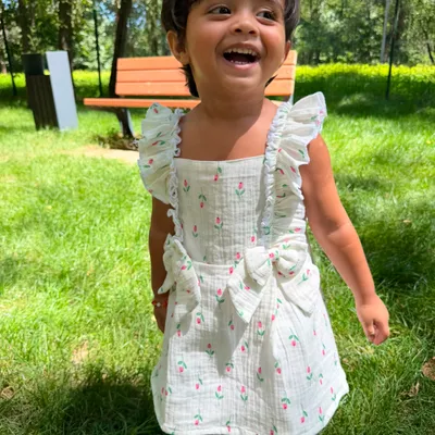 Tulip Garden Ruffle Bow Dress — Girls Sleeveless Floral Muslin Sundress